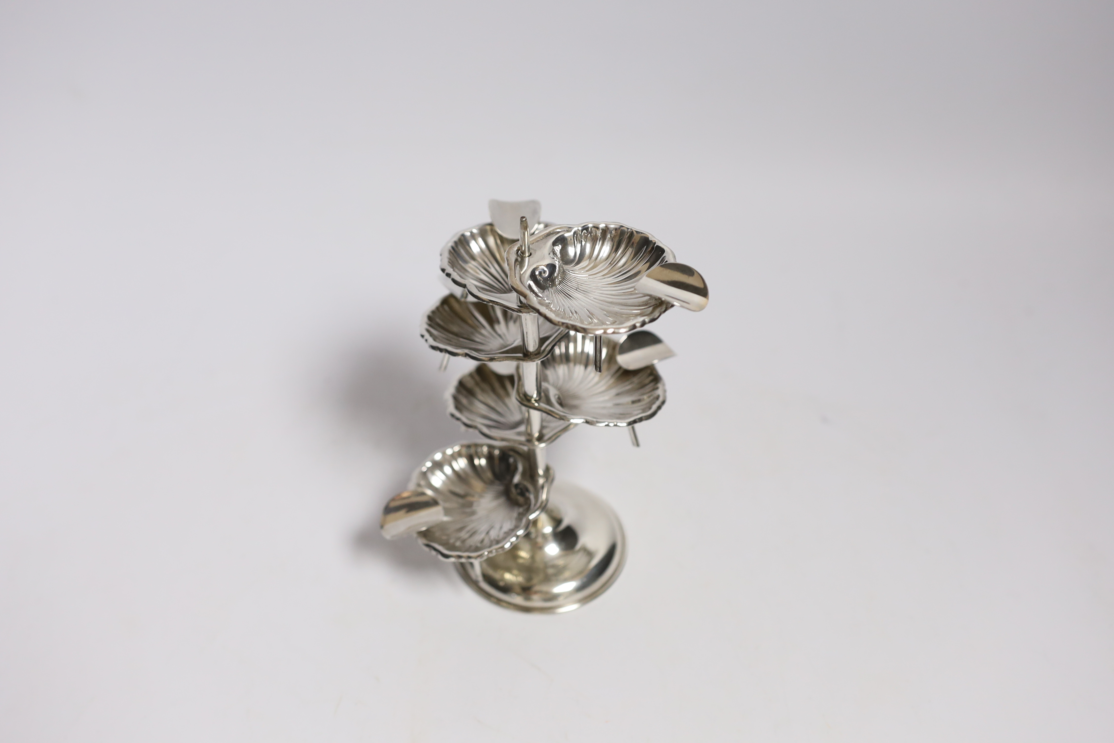 A Mexican 925 sterling ashtray stand, with six detachable shell shaped 925 sterling ashtrays, overall height 14.2cm, 3.8 oz.